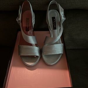 Strappy silver heels gently used size 7.5 M